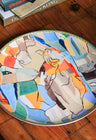 Designer dinnerware set, featuring urban geometric shapes and inspired by the virtues of freedom, courage, and royalty.